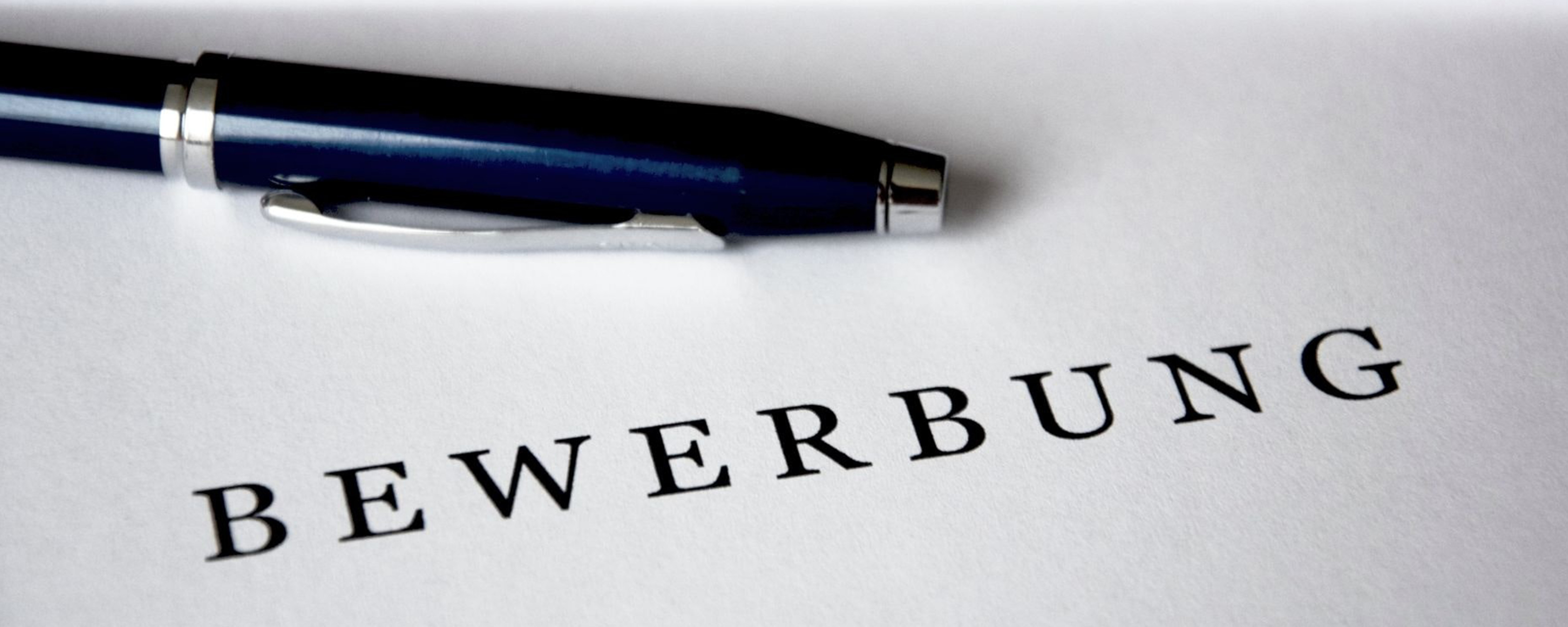 Abbildung Bewerbung mit Kugelschreiber. 